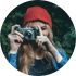 Girl with camera and red beanie
